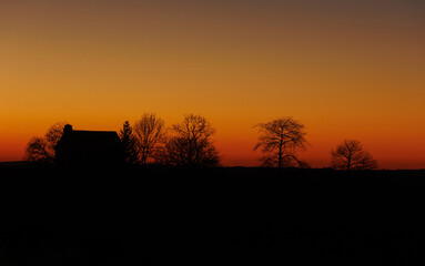 country house silhouette after sunset
