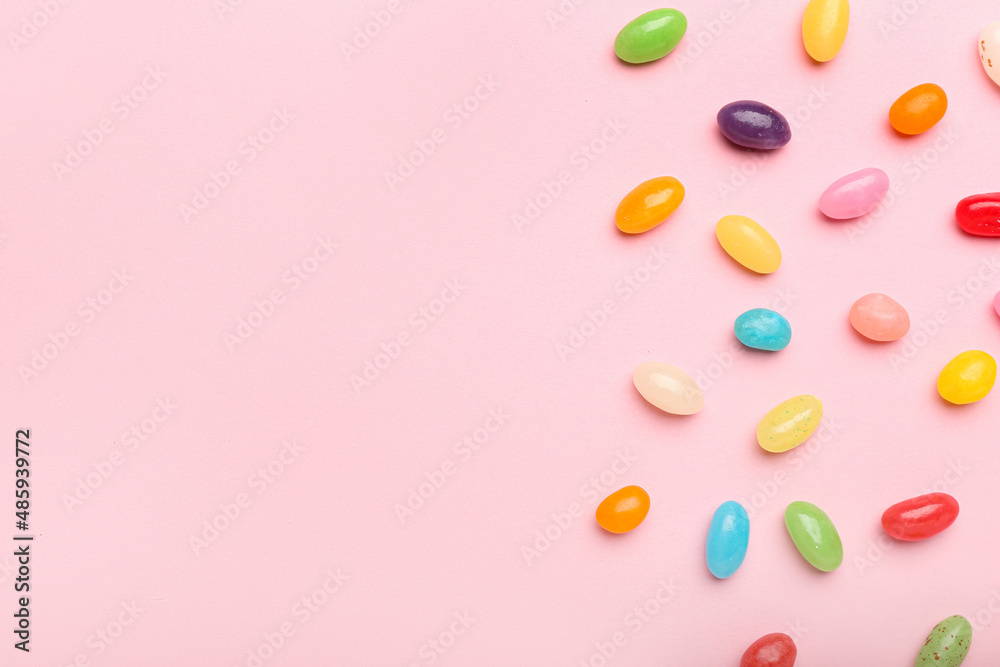 Wall mural multicolored jelly beans on color background