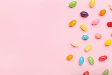 Gordijnen Multicolored jelly beans on color background © Pixel-Shot