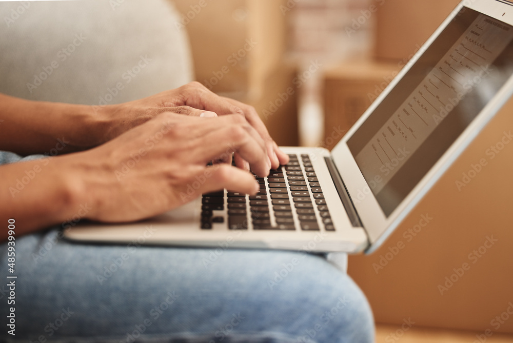 Poster looking for the perfect place to call home. shot of an unrecognizable person using a laptop at home.