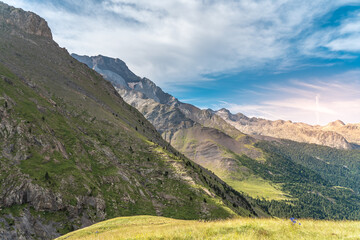 Beautiful mountain landscape sunset. Scenic view of a colorful sky above the mountains. Adventure travel concept.