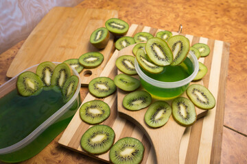 Jelly and kiwi cut into rings on a wooden background