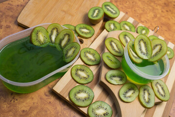Jelly and kiwi cut into rings on a wooden background