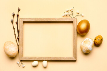 Naklejka na ściany i meble Composition with photo frame, Easter eggs and flowers on beige background