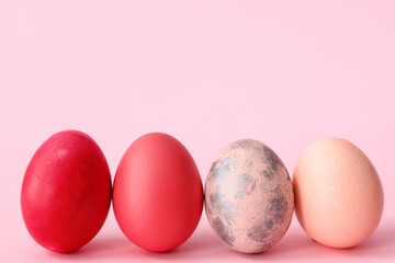 Beautiful Easter eggs on pink background