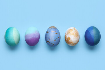 Set of beautiful Easter eggs on color background