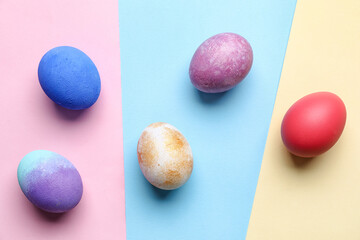 Bright Easter eggs on color background