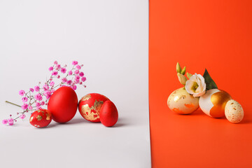 Easter eggs and flowers on color background