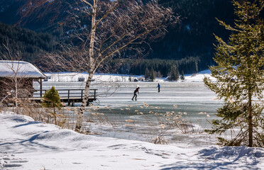 skating on a frozen lake in winter 