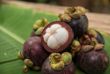 mangosteen lay on banana leaf