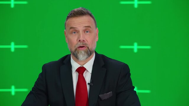Newsroom TV Studio Live News Program with Green Screen Background: Male Presenter Reporting, Talking and Listening. Television Cable Channel Anchor. Network Broadcast Mock-up Playback. Static Medium