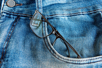 eyeglasses in jeans pocket.