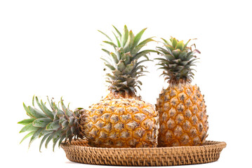 Fresh pineapple fruit in basket on white background, Tropical fruit