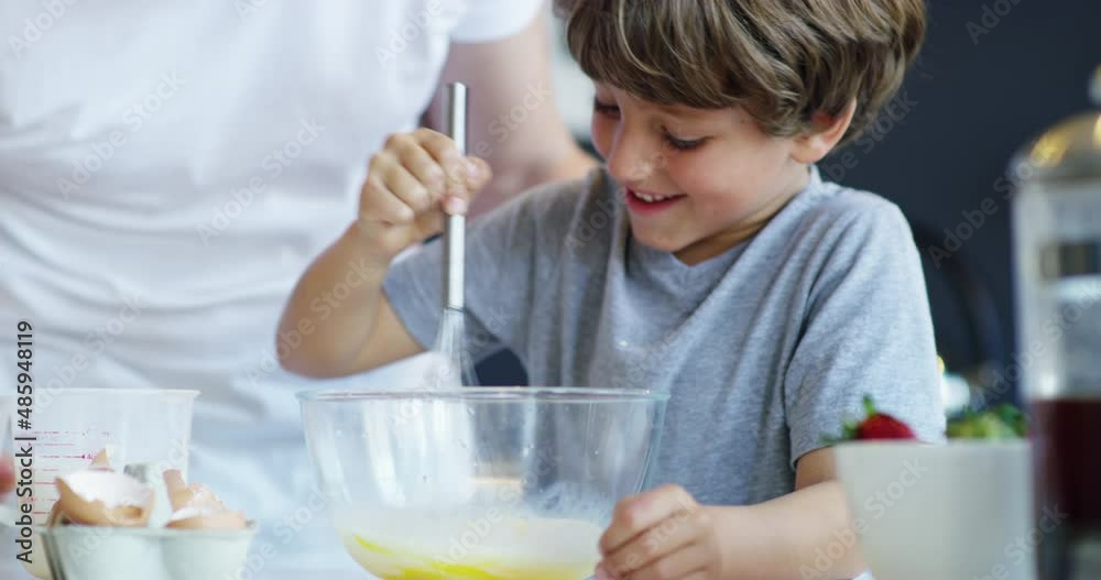 Sticker Hell be the worlds best baker one day. 4k video footage of an adorable little boy baking with his father at home.