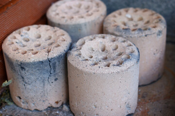 The briquettes that are burnt white.