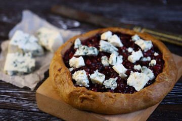 Homemade galette with cranberries and blue cheese.