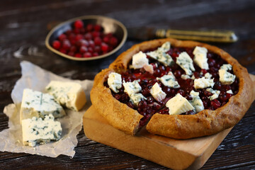 Homemade galette with cranberries and blue cheese.