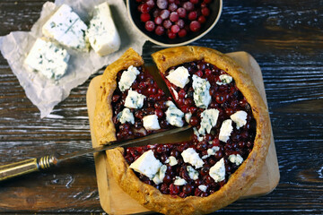Homemade galette with cranberries and blue cheese.