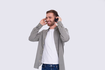 Man Listening to Music Enjoying It. Man Listening Music with wireless headphones Isolated Looking to Side