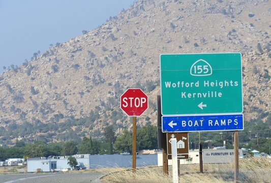 Roadside stop sign and directions to Wofford heights Kernville, California