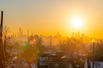 Manhattan skyline sunset in the city, taken from New Jersey residential neighborhood.