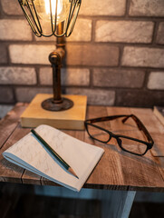 Vintage Lamp, old books, glasses, pencil and notes