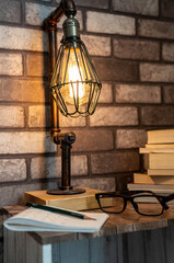 Vintage Lamp, old books, glasses, pencil and notes