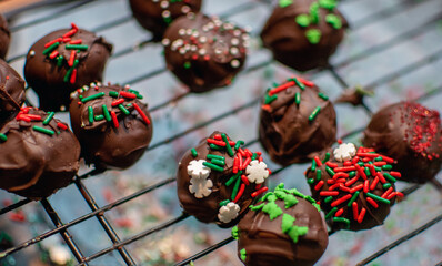  Festive Cake balls for Christmas, a bite size scoop of cake mixed with frosting, rolled by hand and dipped in chocolate