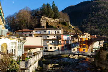 View of medieval Spain town of Camprodon with Ter river and ancient stone bridge Pont Nou