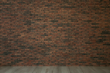 Empty room with red brick wall and wooden floor