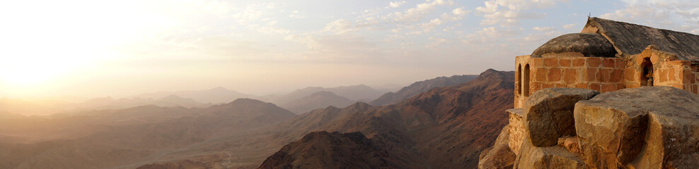 Beautiful sunrise on top of Mousa Mountain in Egypt, South Sinai. An ancient monastery on the top...