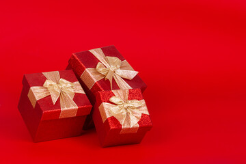 Saint Valentine's day present boxes. Red background.
