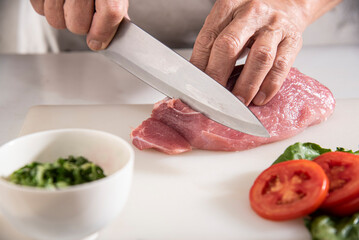chef cutting meat