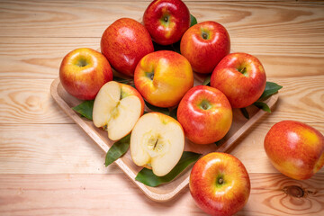 Fresh red Envy apple  on wooden background. Envy apple on wooden box packaging ready to sell.