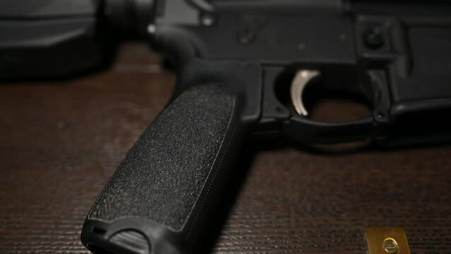 AR15 assault rifle grip to trigger slider toward the gun