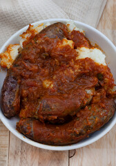 Traditional south African pap and Wors, maize meal with sausage and chakalaka sauce

