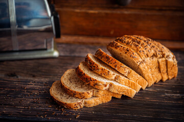 Freshly Baked Whole Wheat Flax Seed Bread Sliced on Rustic Wooden Table