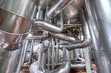 A complex and intricate system of steel pipelines, stainless insulation.