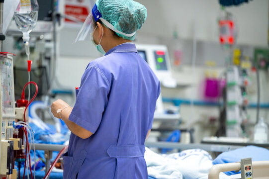 The specialist are checking continuous renal replacement therapy equipment and injection pump and hemodialysis machine.