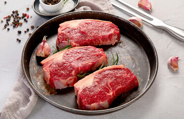 Grilled fish, seafood and meat assortment on light background.