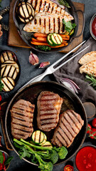 Grilled barbecue meat assortment on dark background.