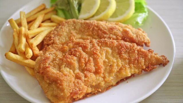 Homemade Breaded Weiner Schnitzel with Potato Chips - Fried Chicken with french fries - European food style