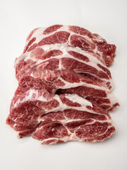 Close up of raw fresh pork steaks. marble beef. Group of fresh raw beef meat steak. Raw meat. fresh raw beef lamb. cooking meat on white. Butchery, market, shop