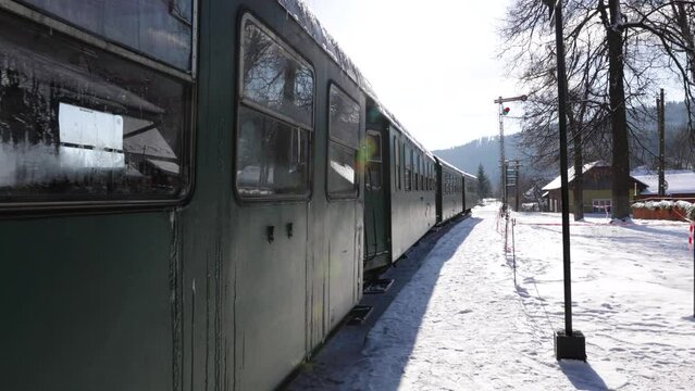 Train at Moldovita Forest Railway - POV Of A Person Walking Along The Steam-powered Train In Mocanita Hutulca Railway Station In Moldovita, Romania.