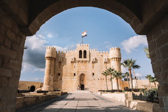 The Citadel of Qaitbay or the Fort of Qaitbay is a 15th-century defensive fortress located on the Mediterranean sea coast. Ordinary people walk nearby