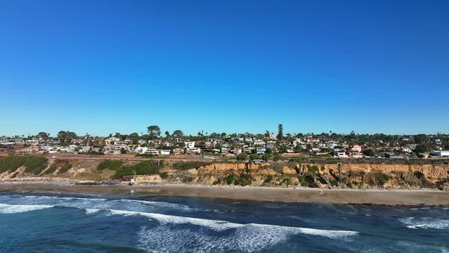 Drone footage of Cardiff By The Sea, San Diego California. Aerial drone moving forward towards city. Beautiful scenery shot.