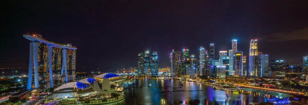 Banner image of Singapore central area at night.
