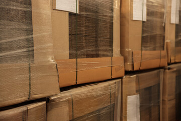 Closeup view of stacked boxes in warehouse. Wholesaling