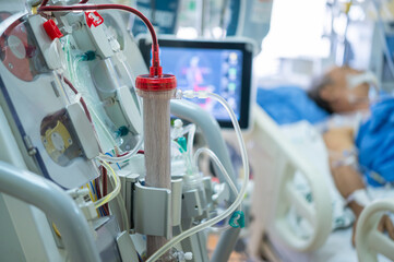 Experts are preparing a dialysis machine for use in critically ill patients in hospital intensive...
