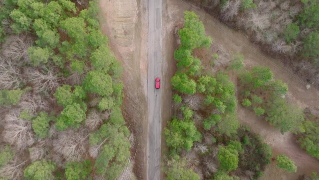 Cinematic Top Down Shot of a Jeep on a Residential Rural Road